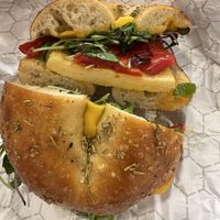Rosemary maldon salt bagel with Just Egg, Violife cheddar, mama’s lil peppers and micro greens    at Sincerely, Bagel in Portland