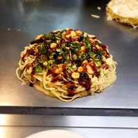 Okonomiyaki with sauces at Nagataya in Hiroshima