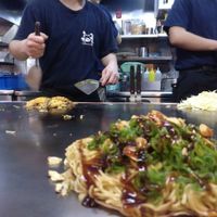the okonomiyaki is cooked just in front of you. at Nagataya in Hiroshima