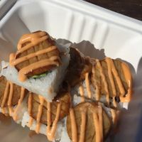 Don't be Shellfish roll -1 piece already devoured. Avocado, cucumber, oyster mushroom, spicy mayo. Yum. at Sushi Love in Portland