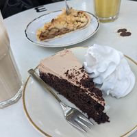 Front: Nougat cake with cream | back: apple cake at Black Veg in Bonn