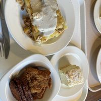Cream cake, layered potatoes with cashew cream and mix of tempeh, seitan fried  at Vega City in Budapest