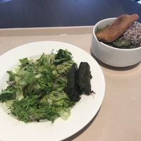 Salad, fried cashew cheese, wheat, and pea soup at Vega City in Budapest