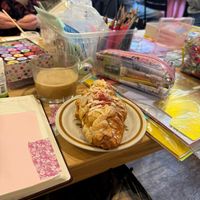 Raspberry croissant and oat latte  at Bee May Bakery in Brighton