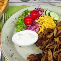 Pita (seitan and oyster mushroom) with very nice and crispy Belgian fries, garlic sauce and veganaise at Mykene in Leuven
