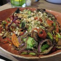 jacked potato, stir fried vegetables, sundried tomatoes and almond parmezan (16€) at Mykene in Leuven