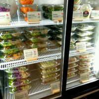 Fridge with plastic containers  at Tanya's Cafe in South West London