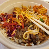 Rice noodles, brown rice, BBQ tofu, bell pepper, mushroom, veg mix, chili crisp. at RICEMILL in Phoenix