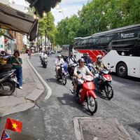 next to a busy canal road at Bánh Mì Chay Tốt - 1315 Hoàng Sa in Ho Chi Minh City