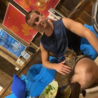 Little kitty sat with us every time  at Mood Food Energy Cafe in Yangshuo