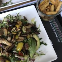 Acapulco salad with grilled veggies and avocado on a bed of romaine -- a bit oily, but still really delicious. Accompanied by truffle fries (unclear if they are definitely vegan). at Hamburgerei in Munich