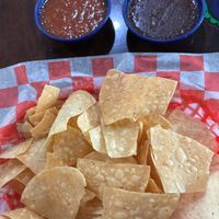 Chips bean dip and salsa  at Mama's Tacos Delicioso Of Pensacola in Pensacola