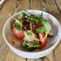 Heritage tomatoes, pickled Crematta, charred artichokes, peppers  at The Red Lion in Cambridge