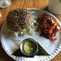 Tuna salad burger with chopped up carrots and sweet potatoes on the side at Casa Macro in Monterrey