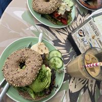 Vegan Avocado Bagel (Bottom) & oat milk coffee  at Bagels & Beans - Statenkwartier in The Hague