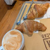 Large cappuccino and vegan brioche at Botega Caffe Cacao Bergamo in Bergamo