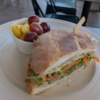 Veggie sandwich with side fruit at Thanks A Latte Espresso Cafe in Camp Verde