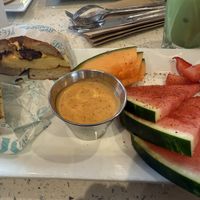 Bagel sandwich, maple sriracha aioli and side of fruitt  at JOi Café in Westlake Village