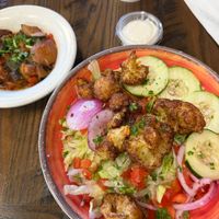 Rice bowl with cauliflower and side of veggies at Laziza Mediterranean Grill - Augusta in Augusta