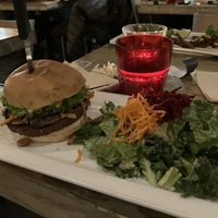Burger with salad  at MeeT on Main in Vancouver