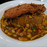 Curry and rice with a soy steak on top at Mile Time in Quito