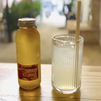 Fresh lemon juice & Dr. Turmeric Kombucha to combat the heat 😶‍🌫️  at Ivegan Supershop Xuan Thuy - Healthy Plant Based Cafe in Ho Chi Minh City