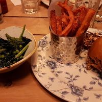 'Thai veggie' with sweet potato fries and a side of green vegetables. at The Cosy Club in Salisbury