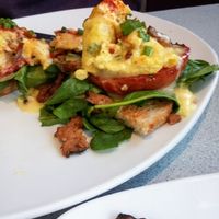 Just Egg Benedict with fire roasted tomato, vegan cheese sauce, tempeh bacon and more tempeh bacon on the side at Silver Diner in Cherry Hill