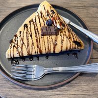A customized vegan sweet crêpe with fresh strawberries, bananas, and blueberries with vegan Hershey’s chocolate with almonds inside and a basic vegan Hershey’s chocolate on to at Bearry Sweet in South Lake Tahoe