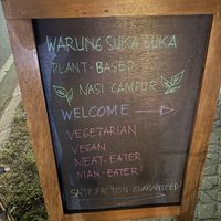 Sign outside   at Warung Suka Suka | Plant-Based Nasi Campur – Kuta Mandalika  in Kuta