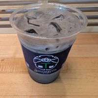 Black sesame latte with oat milk at TOKUYAMATCHA & ONIGIRAZU BAR SoHo in New York City