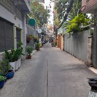 The main alleyway after leaving the main street. The restaurant is located on the left about 20 metres away. Look out for a yellow banh mi stall. at An Tinh Vegan Food  in Ho Chi Minh City