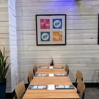 Nice artwork and tables that seat up to 6.  at Hi-Lo Taco Co. in Philadelphia