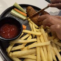 Kids veggie sausage and chips  at Caraway Cafe - Finest Indian Vegan & Vegetarian Cuisine in Gerrards Cross