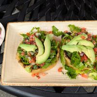 Sopes La Maria! Thick corn tortilla cups, no cheese/crema, refried/black beans, avocado, pico de gallo, & lettuce. Ask for hot sauce & pickled onions to maximize flavor!  at Manolete's Cocina Gourmet in Winchester
