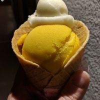 Mango Sorbet (bottom) with an ";Izzy Scoop"; of Lemon Sorbet on top. at Izzy's Ice Cream in Minneapolis