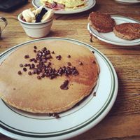 Vegan chocolate chip pancake with vegan sausage and fruit at The Bad Waitress in Minneapolis