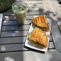 waffle sandwich with vegan cheese, tomato, spinach, and spicy mayo  at RELAY Coffee Roasters in Hamilton