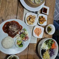 Soybean steak, steamed dumplings and bibimbap  at Dajeon Cafe in Busan