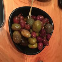 Warm olives in a delicious herb and garlic dressing. at Block Kitchen and Bar in Banff