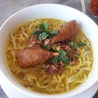 yellow curry noodles with drumsticks at Vegan Glory in Los Angeles