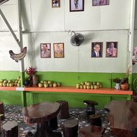 You can enjoy your meals on a wooden table.  at Tamachat in Chiang Rai