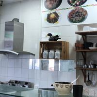 Above the coffee and the sugar you see the owner of the shop (presumably) at Falafel Abu Dany in Larnaca