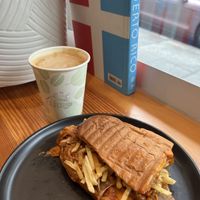 Biscocho latte and tripleta sandwich  at El Cerro in Seattle