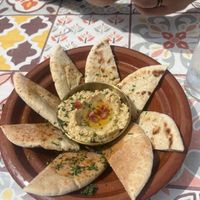 Hummus and bread   at BLUE MAN in Brighton