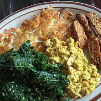 The gluten-free breakfast sampler.Wayward's signature scrambled seasoned tofu, hashbrowns, garlic steamed greens and tempeh bacon. at The Wayward Cafe in Seattle