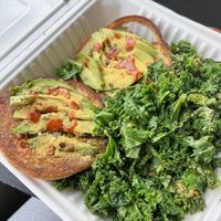 Avocado toast with a side of Kale (I had added hot sauce and nutritional yeast to my toast)  at The Wayward Cafe in Seattle