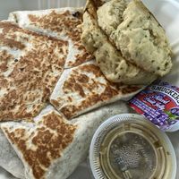 Breakfast Crunchwrap with a side of biscuits  at The Wayward Cafe in Seattle
