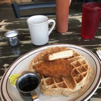 Savory waffle with a vegan schnitzel and maple syrup  at The Wayward Cafe in Seattle