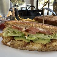 Tempeh “bacon” lettuce tomato and avocado yum! Spinach salad too  at The Wayward Cafe in Seattle